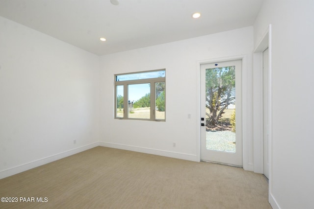 unfurnished room with baseboards, recessed lighting, and a healthy amount of sunlight