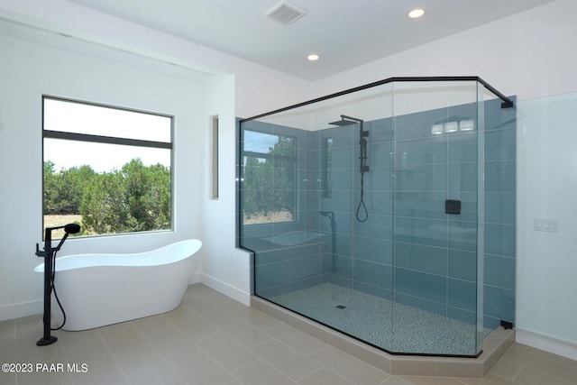 full bathroom featuring a stall shower, visible vents, tile patterned floors, a freestanding bath, and recessed lighting