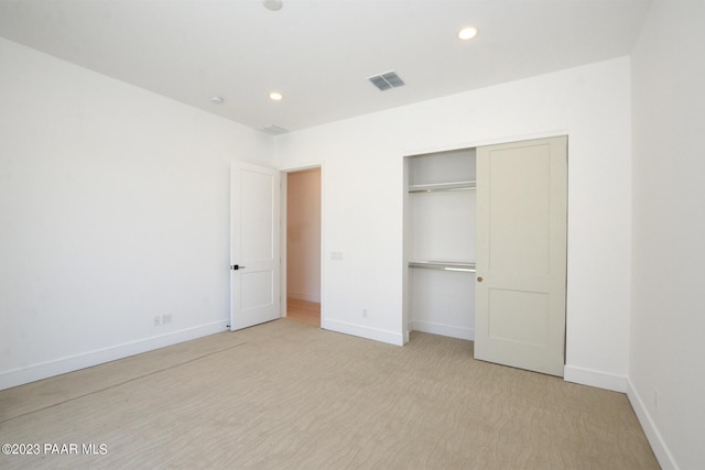 unfurnished bedroom featuring a closet, recessed lighting, visible vents, and baseboards