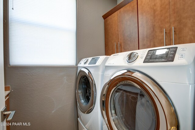 5393 Crescent Edge Dr, Prescott, AZ 86301 - laundry area with cabinet space and washer and clothes dryer