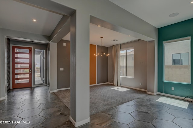 5393 Crescent Edge Dr, Prescott, AZ 86301 - foyer entrance with a chandelier, baseboards, dark colored carpet, dark tile patterned flooring, and recessed lighting