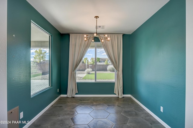 5393 Crescent Edge Dr, Prescott, AZ 86301 - unfurnished dining area with a chandelier and baseboards