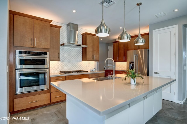 5393 Crescent Edge Dr, Prescott, AZ 86301 - kitchen with stainless steel appliances, wall chimney exhaust hood, a sink, light countertops, and a center island with sink