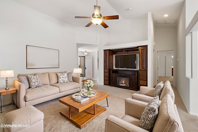 1634 Addington Dr, Prescott, AZ 86301 - living area featuring high vaulted ceiling, ceiling fan, light colored carpet, a glass covered fireplace, and attic access
