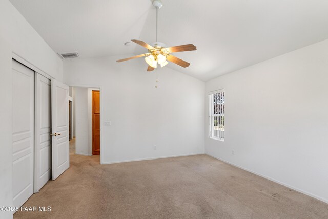 1634 Addington Dr, Prescott, AZ 86301 - unfurnished bedroom with vaulted ceiling, light carpet, a closet, and a ceiling fan