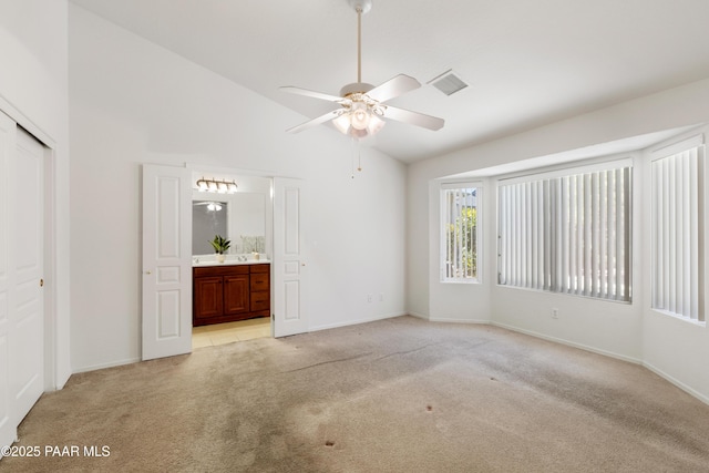1634 Addington Dr, Prescott, AZ 86301 - unfurnished bedroom featuring light carpet, high vaulted ceiling, ensuite bath, a closet, and ceiling fan