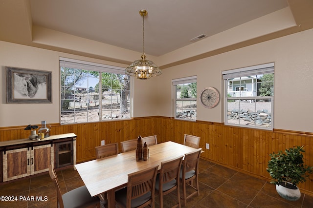 4860 W Stazenski Rd, Prescott, AZ 86305 - dining space with wooden walls, wainscoting, and a notable chandelier