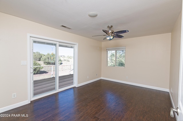 4860 W Stazenski Rd, Prescott, AZ 86305 - spare room with a ceiling fan, baseboards, visible vents, and dark wood-type flooring