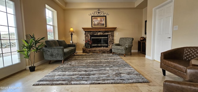 4860 W Stazenski Rd, Prescott, AZ 86305 - living area with baseboards, light tile patterned flooring, and a stone fireplace