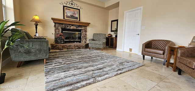 4860 W Stazenski Rd, Prescott, AZ 86305 - living area featuring baseboards, a stone fireplace, and tile patterned flooring