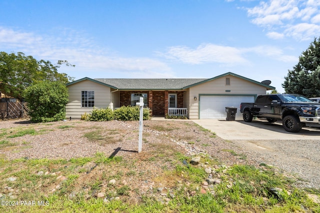 ranch-style home featuring a garage