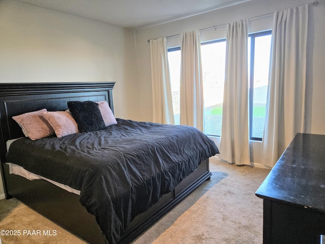 bedroom with light carpet