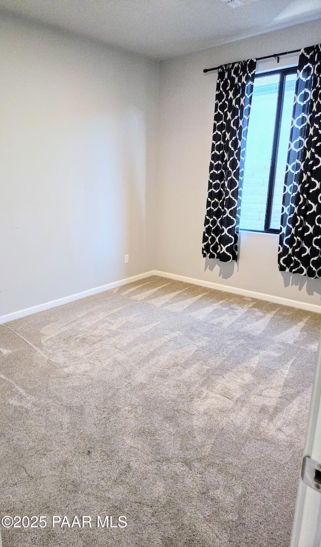 unfurnished room with carpet floors