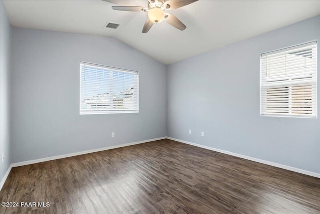 unfurnished room featuring dark hardwood / wood-style floors, ceiling fan, and vaulted ceiling