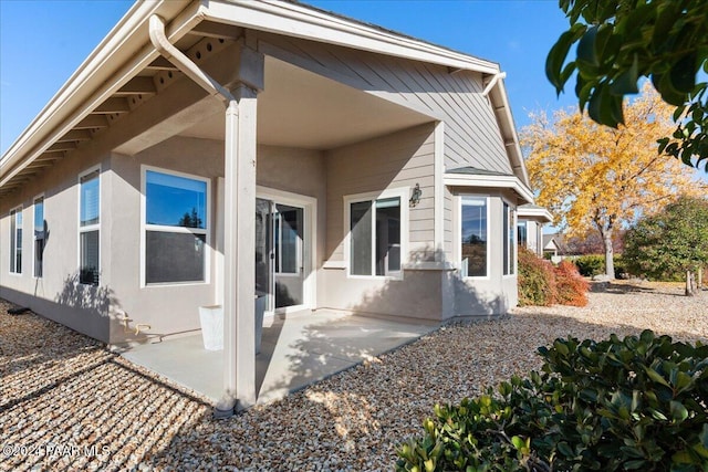 rear view of property featuring a patio