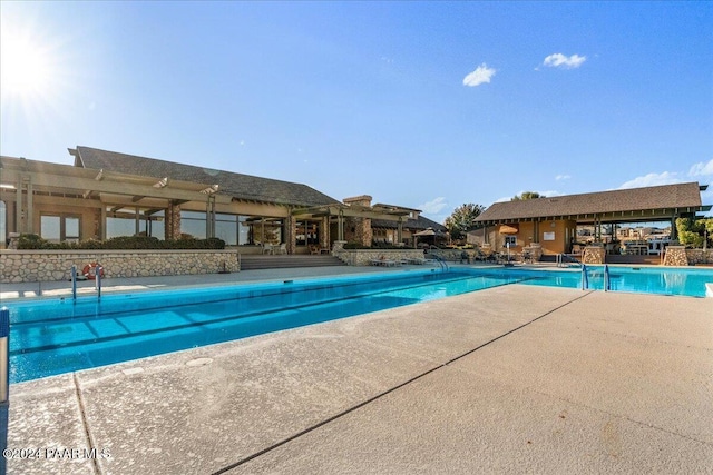 view of pool featuring a patio