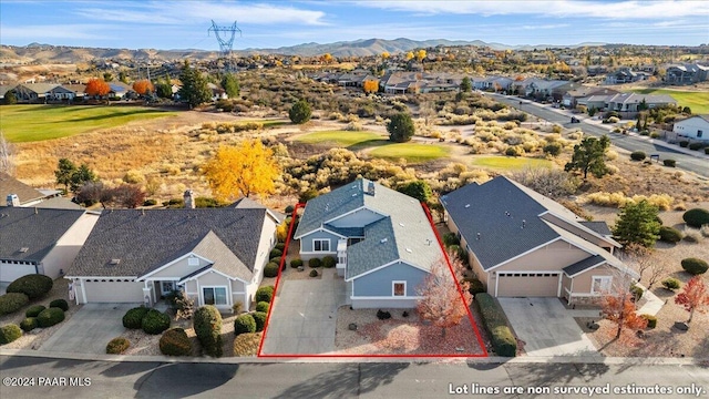 birds eye view of property featuring a mountain view