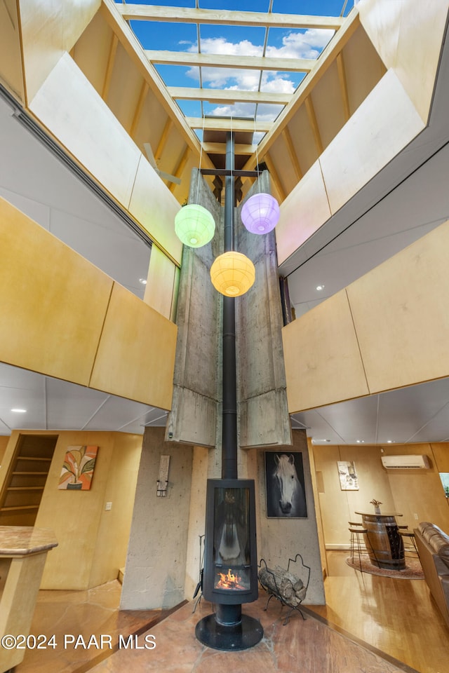 interior details featuring a fire pit and a wood stove