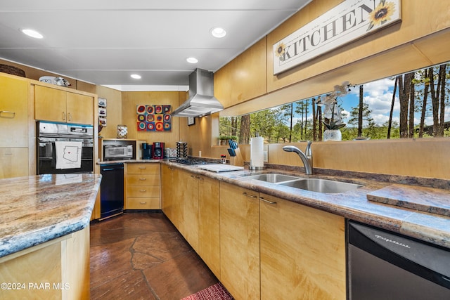 kitchen featuring island range hood, light brown cabinetry, sink, light stone counters, and black appliances