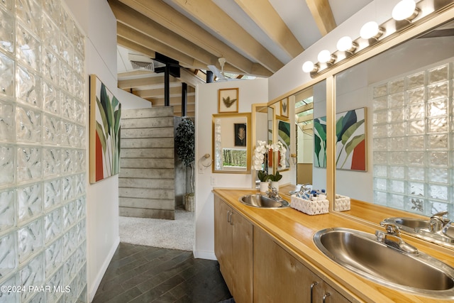 bathroom featuring vanity and beam ceiling