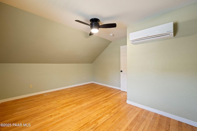 213 N Virginia St, Prescott, AZ 86301 - additional living space featuring an AC wall unit, light wood-type flooring, ceiling fan, baseboards, and vaulted ceiling
