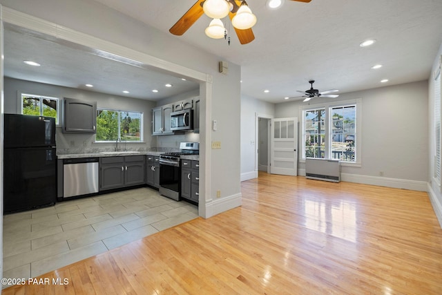 213 N Virginia St, Prescott, AZ 86301 - kitchen featuring stainless steel appliances, a sink, ceiling fan, gray cabinetry, and plenty of natural light