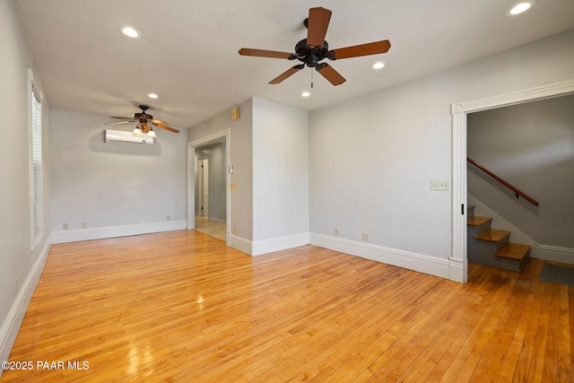 213 N Virginia St, Prescott, AZ 86301 - unfurnished room with ceiling fan, light wood finished floors, recessed lighting, a wall mounted AC, and stairway