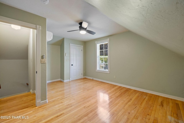 213 N Virginia St, Prescott, AZ 86301 - additional living space with light wood-type flooring, lofted ceiling, ceiling fan, and baseboards