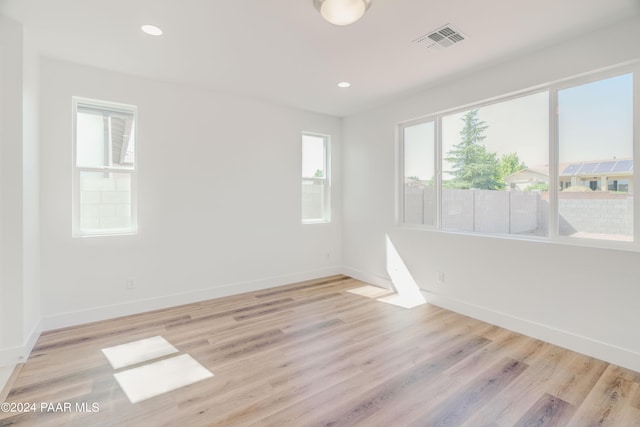 spare room with light wood-type flooring