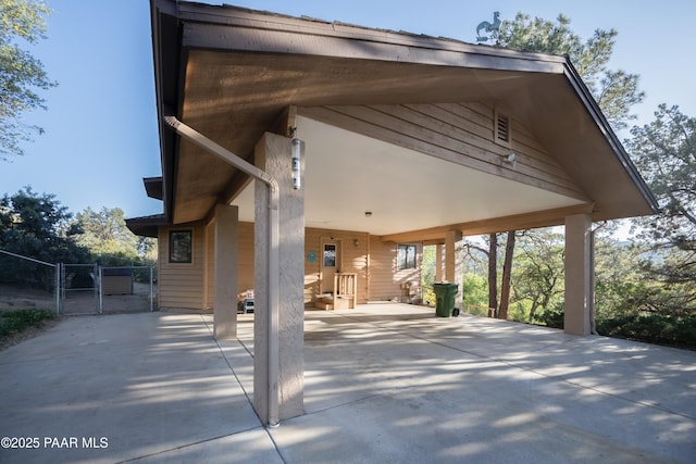 1104 Country Club Dr, Prescott, AZ 86303 - view of patio featuring a gate, a carport, and concrete driveway