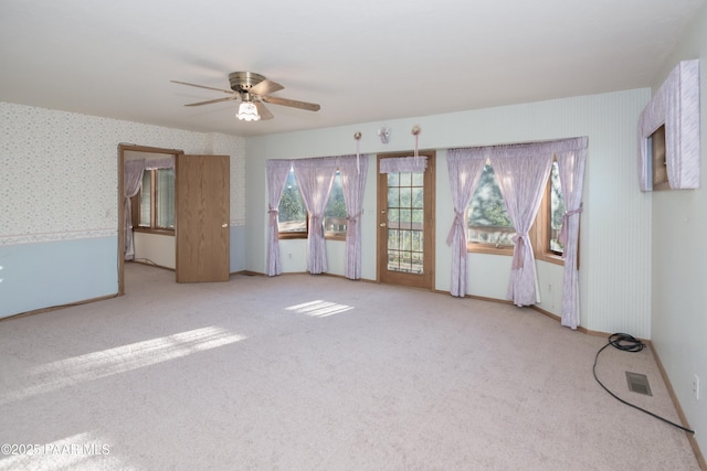 1104 Country Club Dr, Prescott, AZ 86303 - spare room featuring wallpapered walls, ceiling fan, and carpet