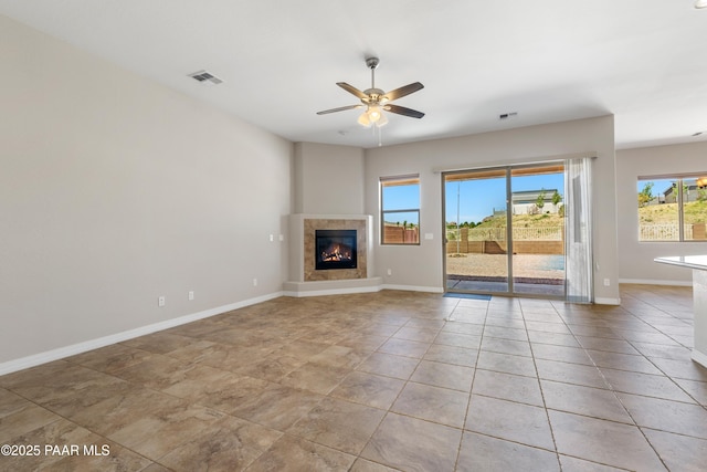 4726 N Salem Pl, Prescott Valley, AZ 86314 - unfurnished living room with ceiling fan, baseboards, and a fireplace