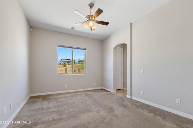 4726 N Salem Pl, Prescott Valley, AZ 86314 - carpeted empty room featuring arched walkways, a ceiling fan, and baseboards