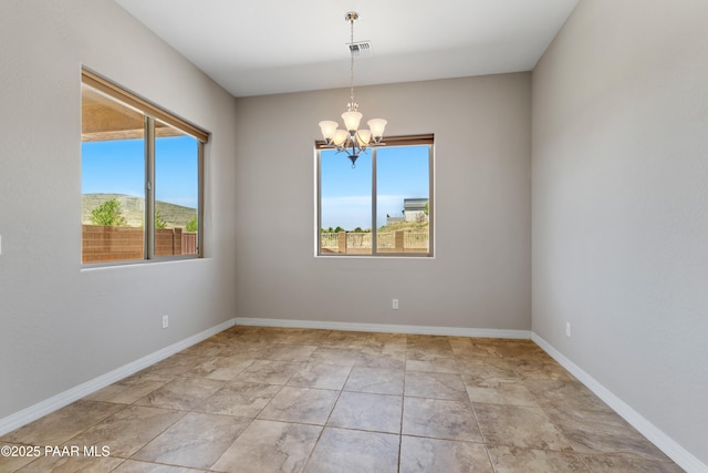 4726 N Salem Pl, Prescott Valley, AZ 86314 - empty room featuring a chandelier and baseboards