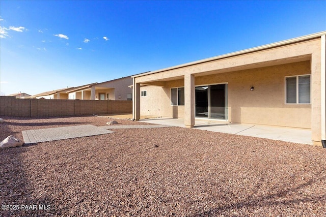 back of property featuring a patio area