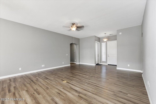 spare room featuring hardwood / wood-style flooring and ceiling fan