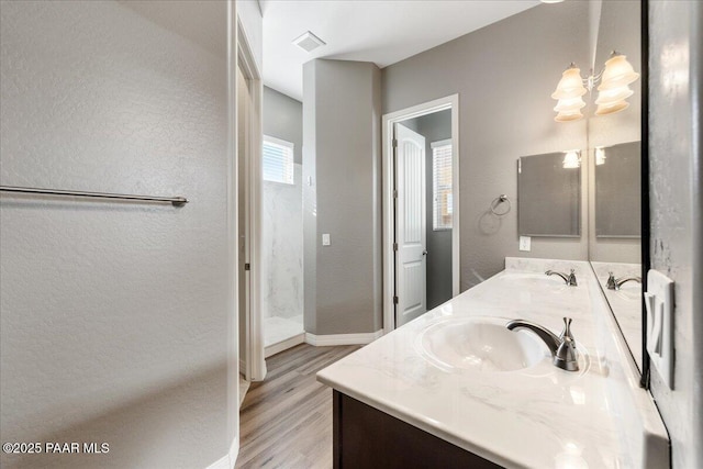 bathroom featuring vanity and wood-type flooring