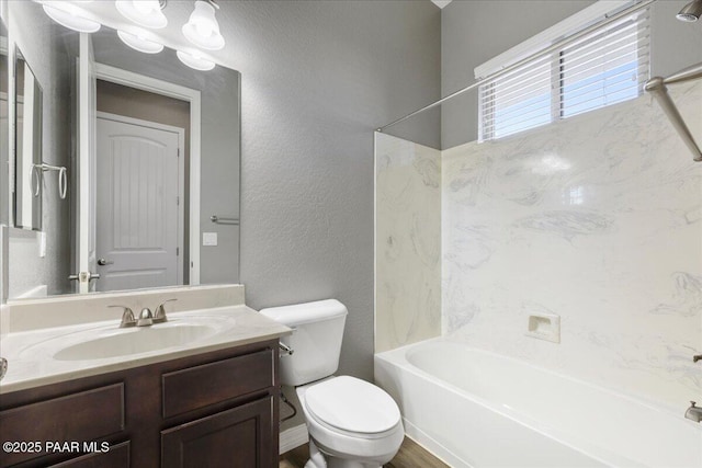 full bathroom with vanity, shower / tub combination, and toilet