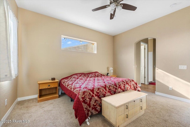 bedroom with ceiling fan and light colored carpet