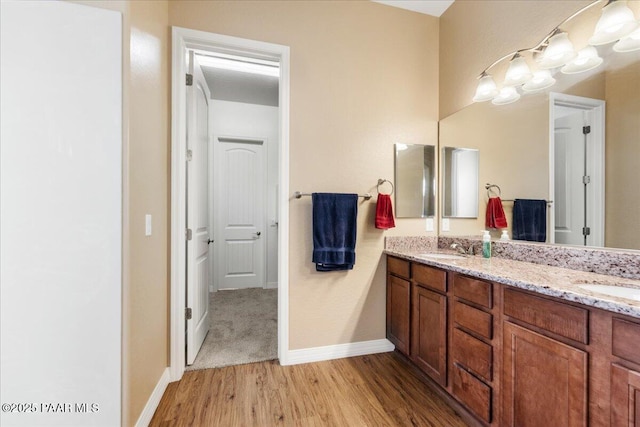 bathroom featuring vanity and wood-type flooring