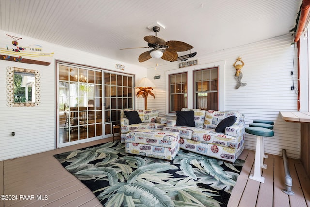 deck with ceiling fan and a porch