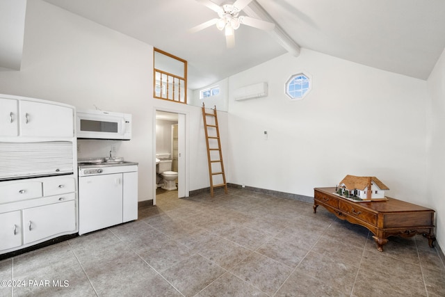 716 Country Club Dr, Prescott, AZ 86303 - kitchen featuring white microwave, ceiling fan, beam ceiling, high vaulted ceiling, and white cabinetry