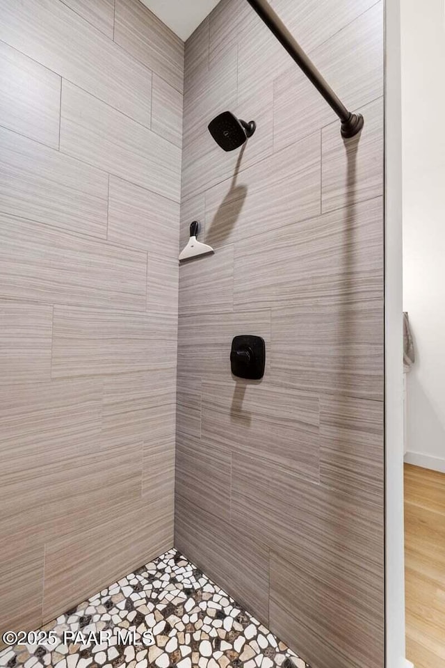 bathroom with a tile shower