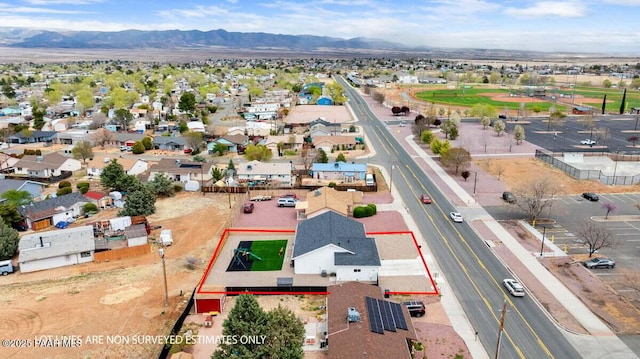 drone / aerial view featuring a mountain view and a residential view