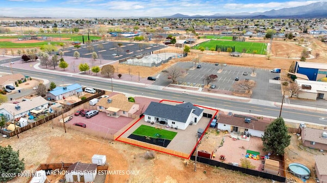 birds eye view of property with a residential view and a mountain view