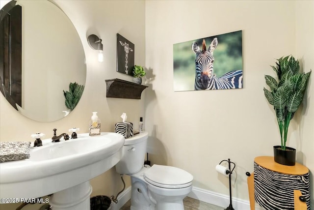 bathroom with sink and toilet