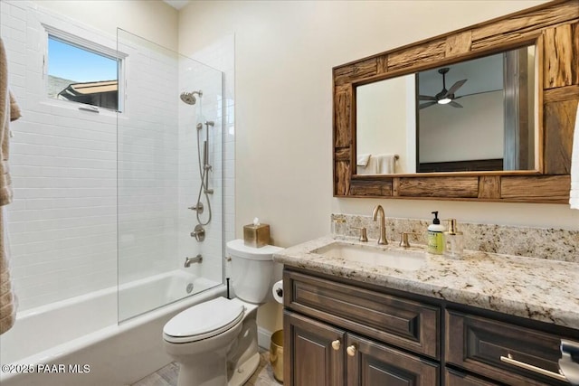 full bathroom featuring vanity, toilet, and tiled shower / bath