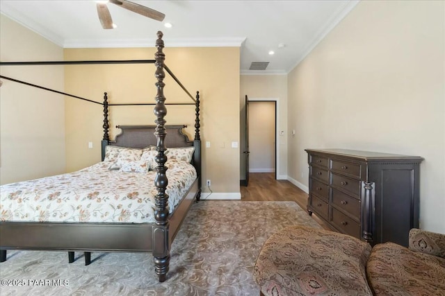 bedroom with ornamental molding and wood-type flooring