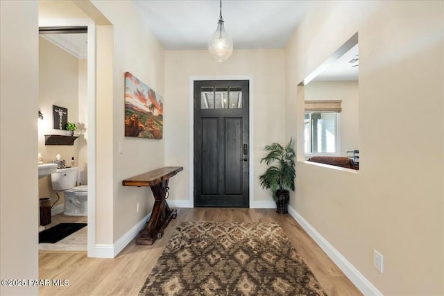 entryway with light hardwood / wood-style floors