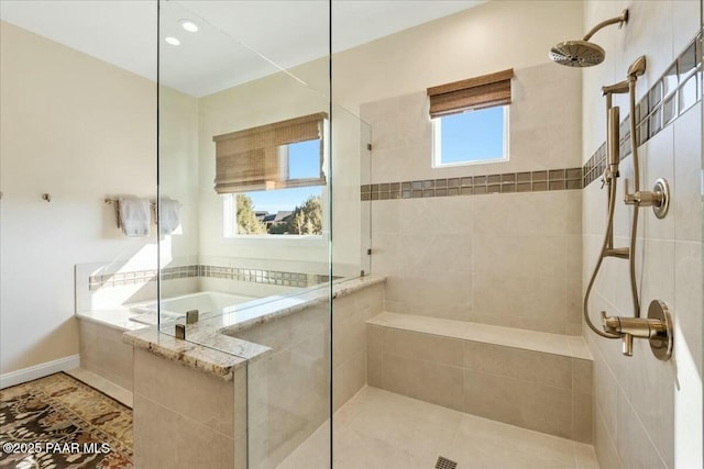 bathroom featuring separate shower and tub